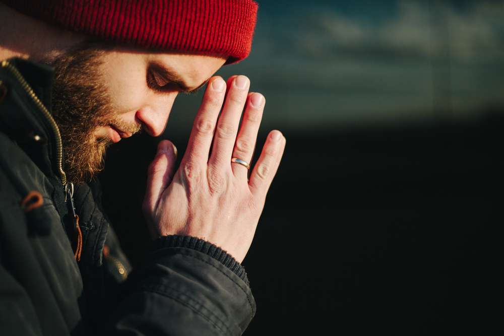 Christian man praying outloud