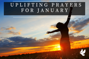 woman prayers at the start of the year in a field at sunrise