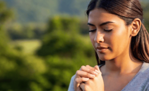 a woman praying for family protection and health