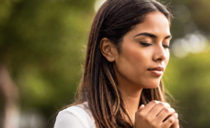 a woman praying outdoor